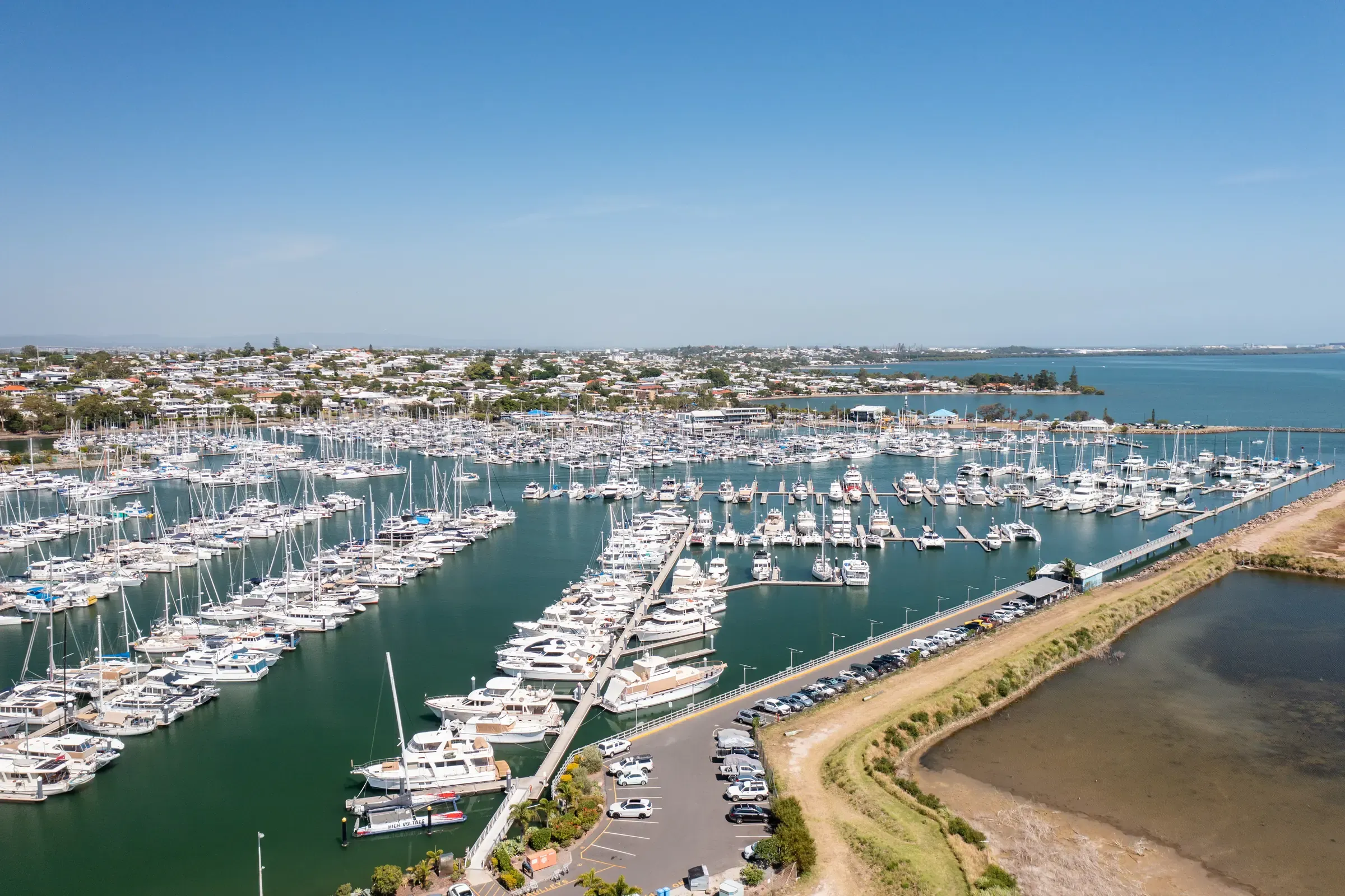 Aerial view of Manly Boat Harbour on Moreton Bay, Brisbane — the marina packed with moored boats
